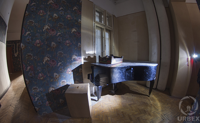 a piano in an abandoned palace