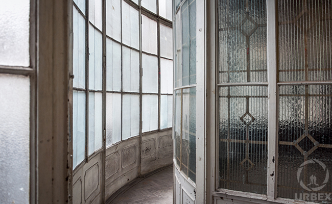 glass balcony in an abandoned palace in hungary