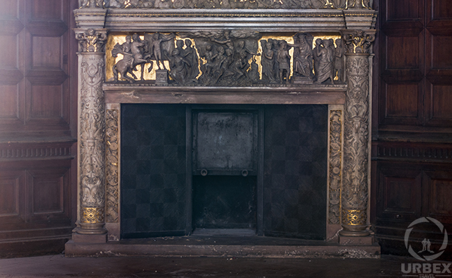 fireplace with relief in an abanoned chateau in budapest
