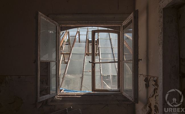 brocken window in abandoned mansion