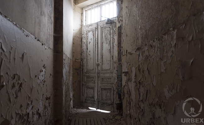 front door of abandoned mansion